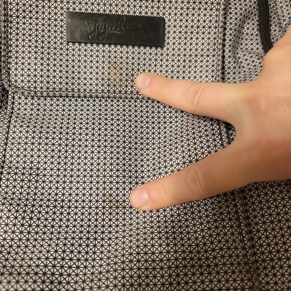 Jujube diaper bag black and white geometric backpack 6 zipper compartments